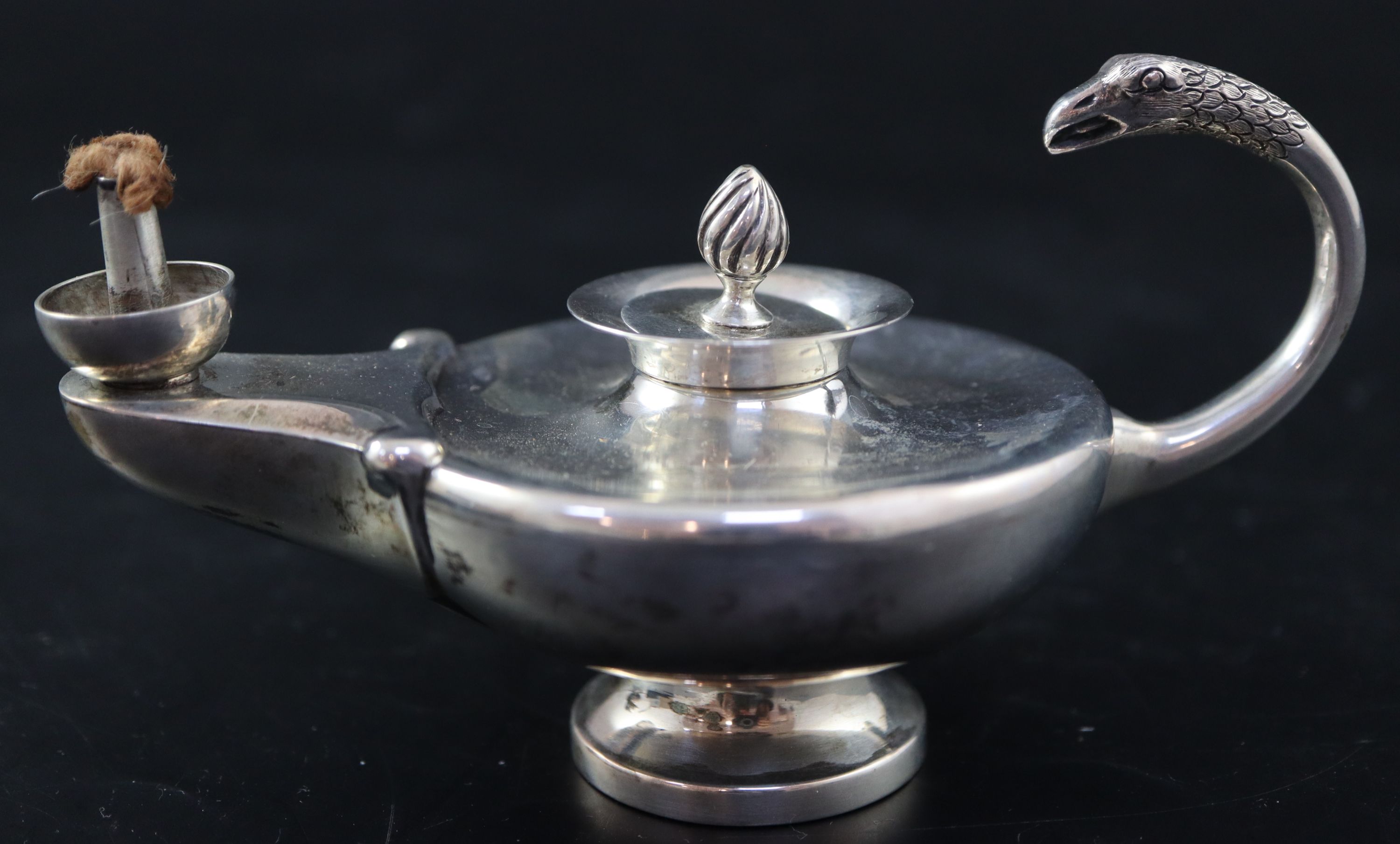 A George V silver Aladdins Lamp club lighter, length 13cm, gross 138 grams.